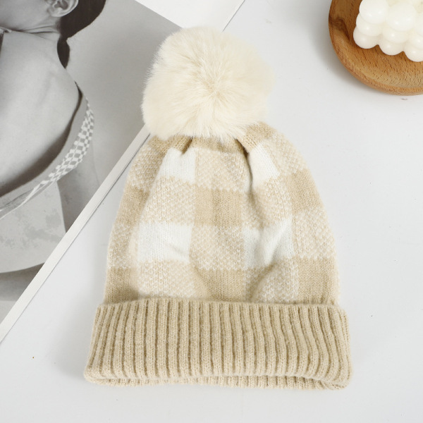 Checkered hat with fur ball