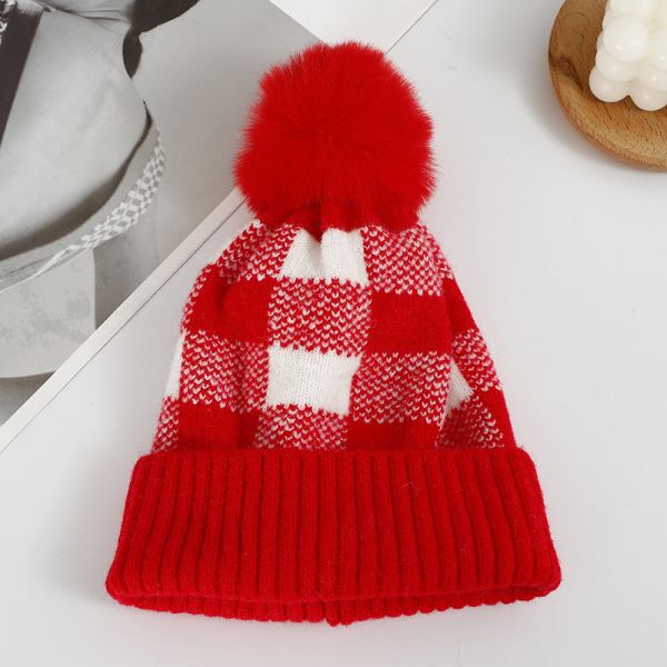 Checkered hat with fur ball