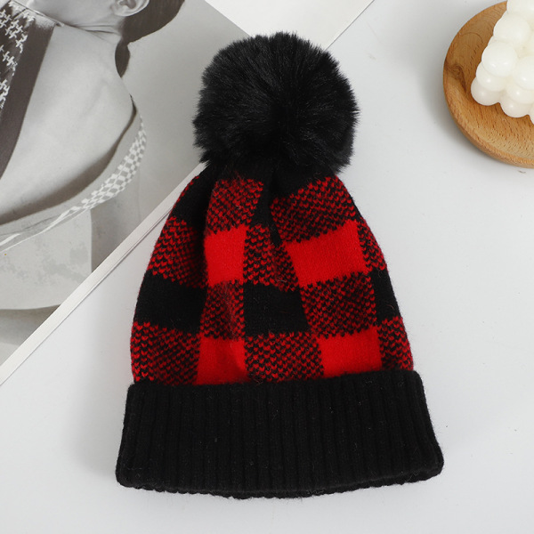 Checkered hat with fur ball